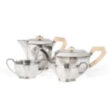 An Art Deco Silver Four Piece Tea Service, Viners Ltd, Sheffield 1954, of panelled oval form and