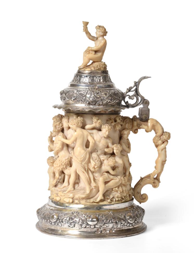 A German Silver Mounted Carved Ivory Tankard, the foot struck with pseudo marks, probably Hanau,