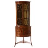 A George III Satinwood and Ebony Strung Free-Standing Corner Cupboard, the arcaded cornice above