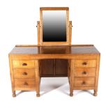 Mouseman: A Robert Thompson Panelled English Oak Dressing Table, with rectangular fixed central