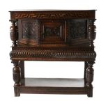 A 17th Century and Later Joined Oak Standing Livery Cupboard, the top with a holly and bog oak