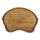Mouseman: A Robert Thompson English Oak Kidney Tea Tray, with carved mouse signature handles, 47cm