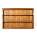 Acorn Industries: An English Oak Hanging Rack, with three fixed shelves, with recessed carved