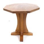 Horseshoeman: An English Oak Octagonal Coffee Table, on a cruciform base, with recessed carved