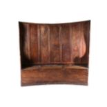 A George III Ash and Elm Panel Back Settle, early 19th century, of curved form with winged sides and