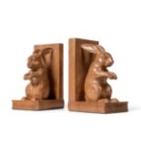 Woodpeckerman: A Pair of Stan Dodds (1928-2012) Carved English Oak Bookends, each with a hare sat on