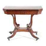 A Regency Mahogany and Ebony Strung Foldover Tea Table, early 19th century, of canted rectangular