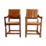 Mouseman: A Pair of Robert Thompson English Oak Panel Back Armchairs, with cow hide seats, set-