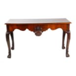 A George III Mahogany Serving Table, late 18th century, the moulded top above a shaped apron centred