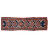 Luri Runner West Iran, circa 1920 The Indigo field with a column of stepped medallions framed by