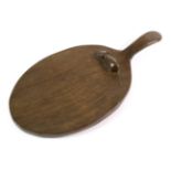 Mouseman: A Robert Thompson English Oak Cheese Board, with carved mouse signature on the board, 35.