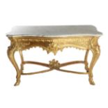 A Giltwood Carved Console Table, of serpentine shaped form with a grey and white marble top above an