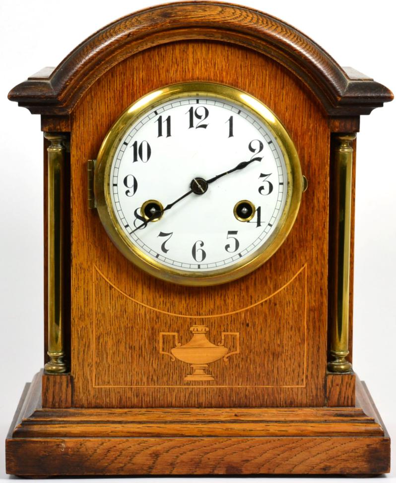 An oak striking table clock, movement stamped Junghans