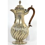 A Victorian silver hot water jug, Charles Stuart Harris, London 1890, baluster part fluted with bead