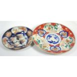 A Japanese Imari circular dish; and a large charger (2)