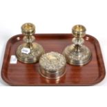 A pair of dwarf silver candlesticks and a silver box