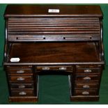 A miniature 1920s style roll top desk