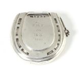 A Victorian silver horseshoe shaped vesta/ lighter, engraved ''F R F to R K 1881'', outer cover