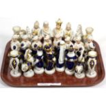 A Royal Dux figural porcelain chess set after a Meissen design (a.f.)20th century. Both kings