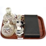 A silver octagonal caster; silver mounted glass scent bottles; condiment set; pencils; tea knives