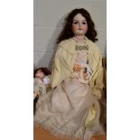 A large Armand Marseille bisque socket head doll, with sleeping brown eyes, open mouth, original