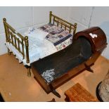 Mahogany dolls cradle and a dolls brass bedstead with bedding (2)