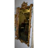 A gold painted rectangular wall mirror