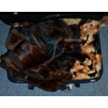 Assorted fur coats, gloves, fox fur and other stoles etc (suitcase)