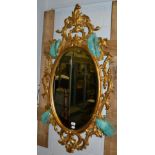 An 18th century style gilt oval mirror