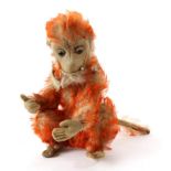 Circa 1920s Schuco Orange Tipped Mohair Smoking Monkey bent limb with jointed arms, crouched legs,