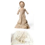 A Late 18th/Early 19th Century Wooden Doll, with large almond shaped eyes, stitched eyebrows and