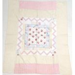 Late 19th Century Quilt, with large central square of floral cotton, surrounded by frames of patched