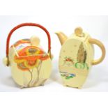 A Clarice Cliff biscuit barrel and an oval teapot