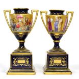 A pair of Vienna porcelain painted and gilt urns on plinth bases decorated with classical figures