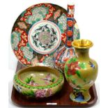 A Japanese Imari bottle vase; a similar plate; and two pieces of Oriental cloisonne (4)