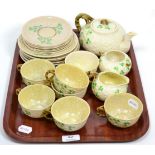 A Belleek teaset with Shamrock pattern, black printed mark, comprising: teapot, milk jug, sugar