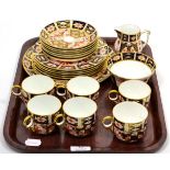 A Royal Crown Derby Imari pattern part tea service comprising six tea cups and saucers, six side