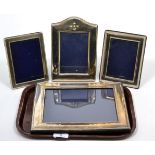Three silver photograph frames and a larger plated example (4)