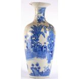 A Chinese Porcelain Baluster Vase, Kangxi, with everted rim, painted in underglaze blue with a court