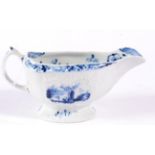 A Lowestoft Porcelain Sauce Boat, circa 1770, painted in underglaze blue with chinoiserie figures in