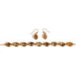 A Circa 1850 Gilt Metal and Citrine Riviere Necklace and Earring Suite, foil backed oval cut citrine