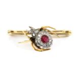 A Ruby and Diamond Spider Brooch, the abdomen inset with an oval cut ruby within a cluster of rose