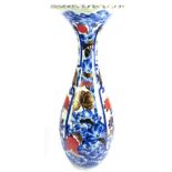 An Arita Porcelain Alcove Vase, Meiji period, of baluster form with flared frilled rim, painted in