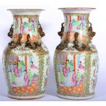 A Pair of Cantonese Porcelain Baluster Vases, 19th century, with mythical beast handles, typically