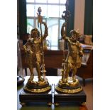 A Pair of Gilt Brass Figural Lamp Bases, 20th century, modelled as a Renaissance soldier and a