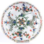 A Chinese Porcelain Saucer Dish, Kangxi, painted in famille verte enamels with a central rosette