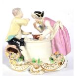 A Chelsea Porcelain Figure Group of a Boy and Girl, circa 1755, she standing, he sitting on a basket