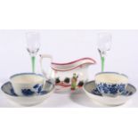 A Pair of Worcester Porcelain Tea Bowls and Saucers, circa 1775, painted in underglaze blue with the