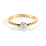 An 18 Carat Gold Solitaire Diamond Ring, a round brilliant cut diamond in a claw setting, to knife