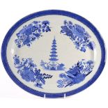 A Chinese Porcelain Oval Platter, Jiaqing, painted in underglaze blue with a seven storey pagoda